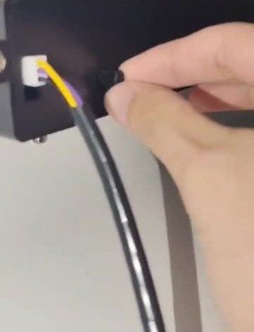 Find the knob (left of the wire connector).